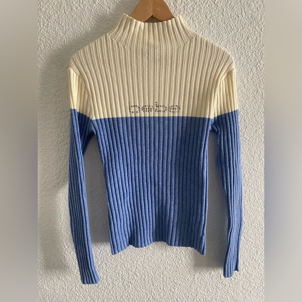 Blue and white Bebe mock neck sweater.
